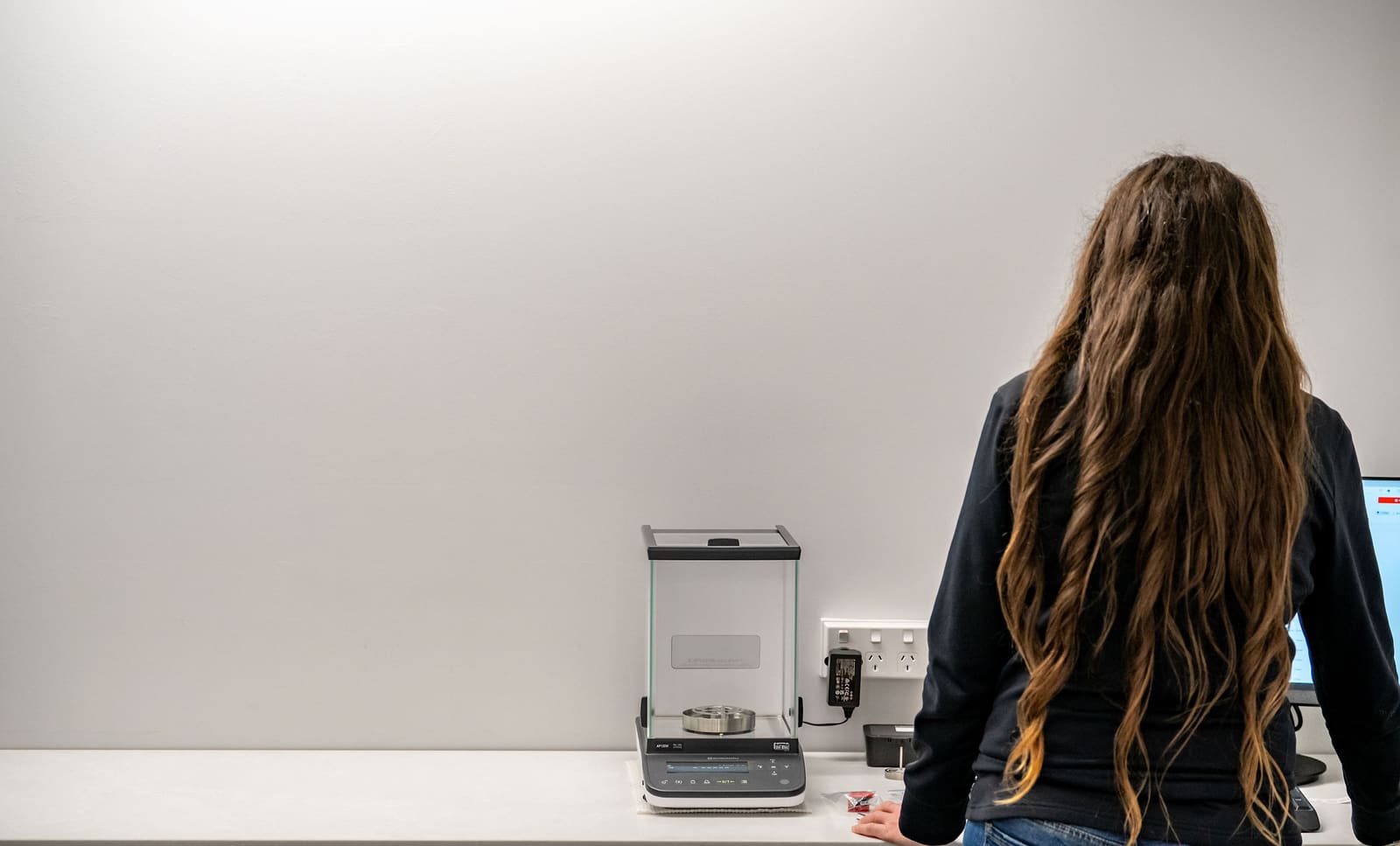 Analyst reviewing exposure data in a wide laboratory