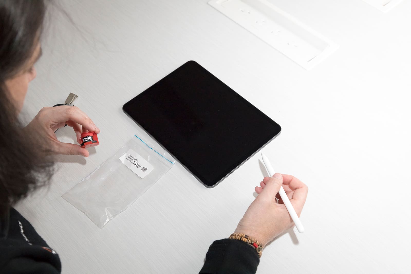 Sampling cassette chain-of-custody being documented on a tablet
