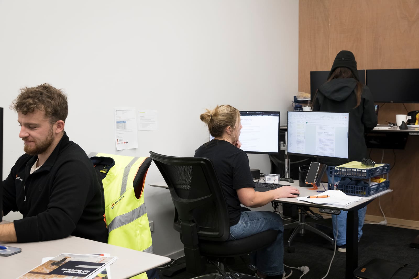 A hygienist and developer reviewing data together at a workstation
