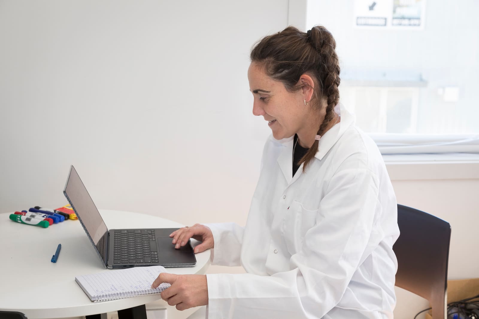 Analyst reviewing results on a laptop in the laboratory