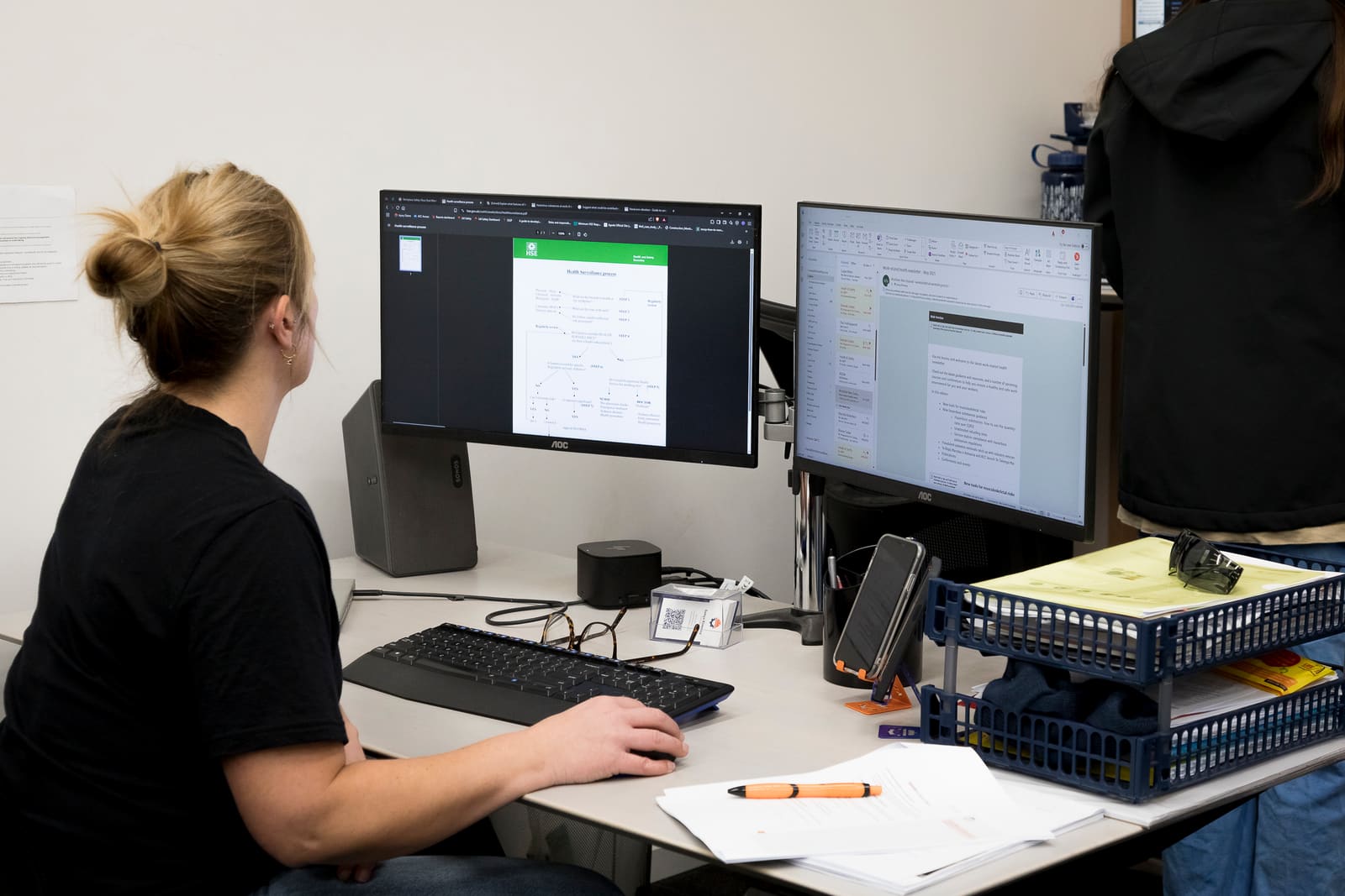 Reviewing industrial hygiene software options on screen at a desk