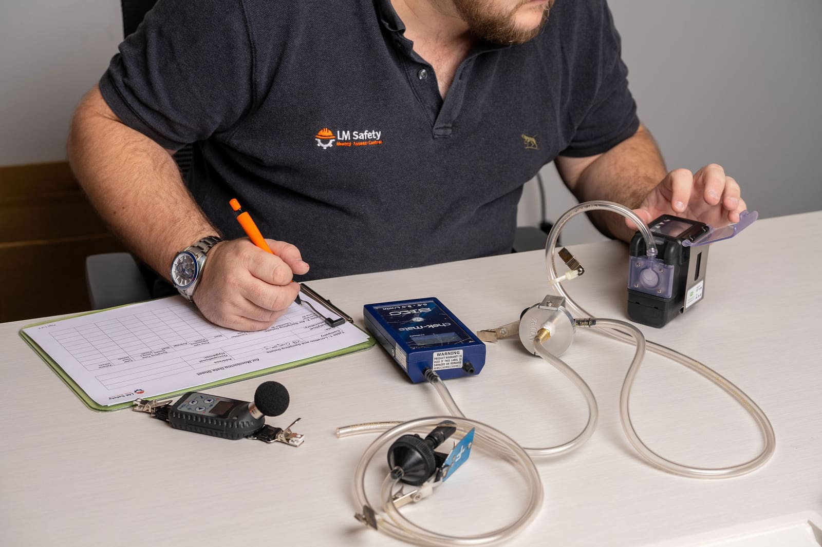 Technician completing equipment records and paperwork